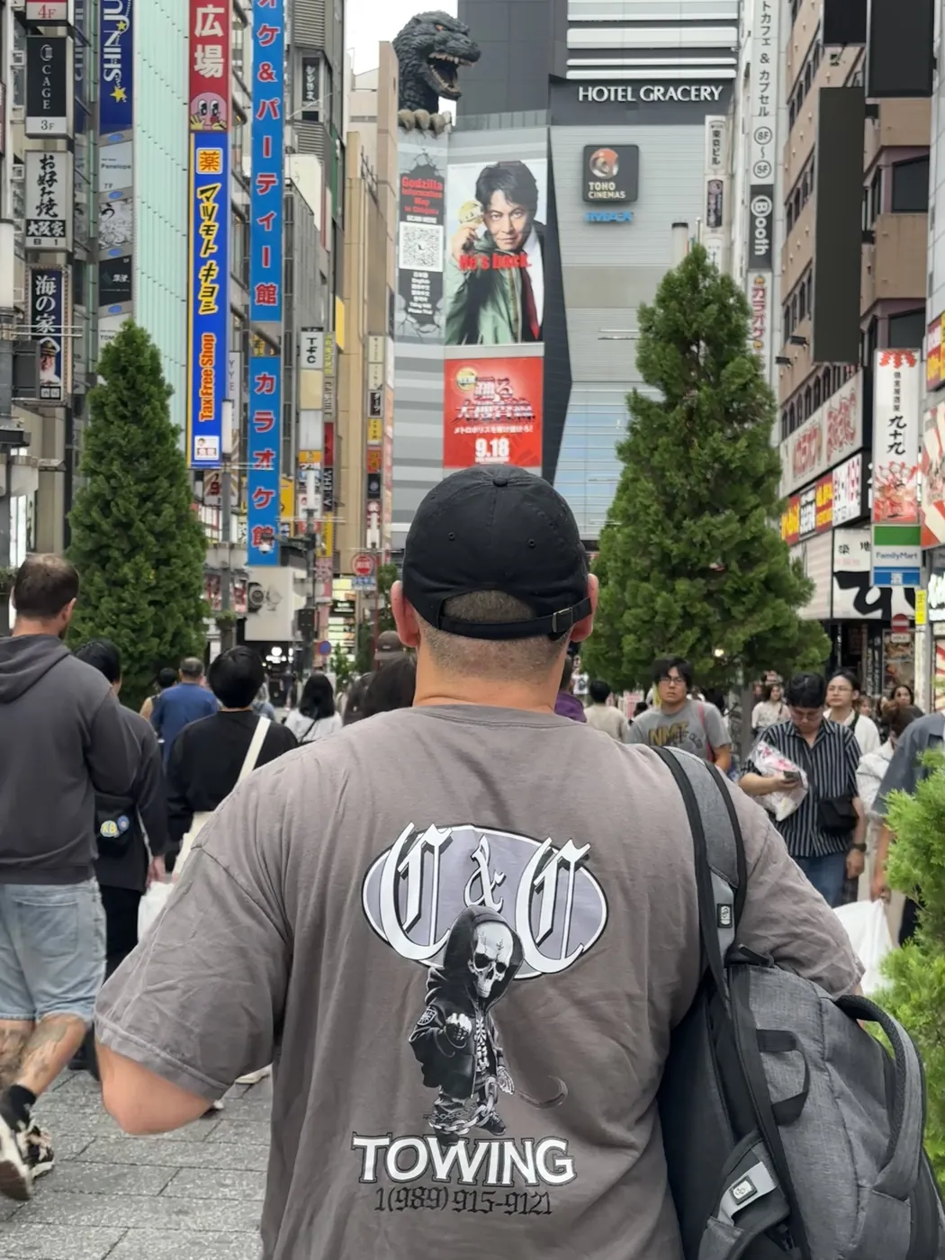 C&C Towing skull logo t-shirt on a busy street in Shinjuku, Tokyo, Japan