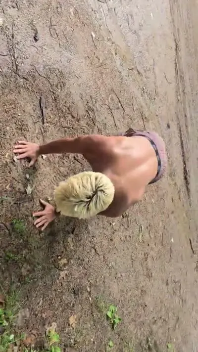 Customer completing 20 push-ups in the woods for $20 off a C&C Inc tow in Northern Michigan